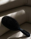 The Rory Rice Bristle Brush  reduces breakage and frizz and promotes natural shine.